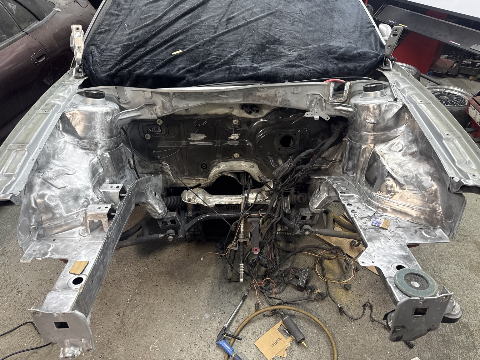 Engine bay with smoothed metal surfaces during fabrication