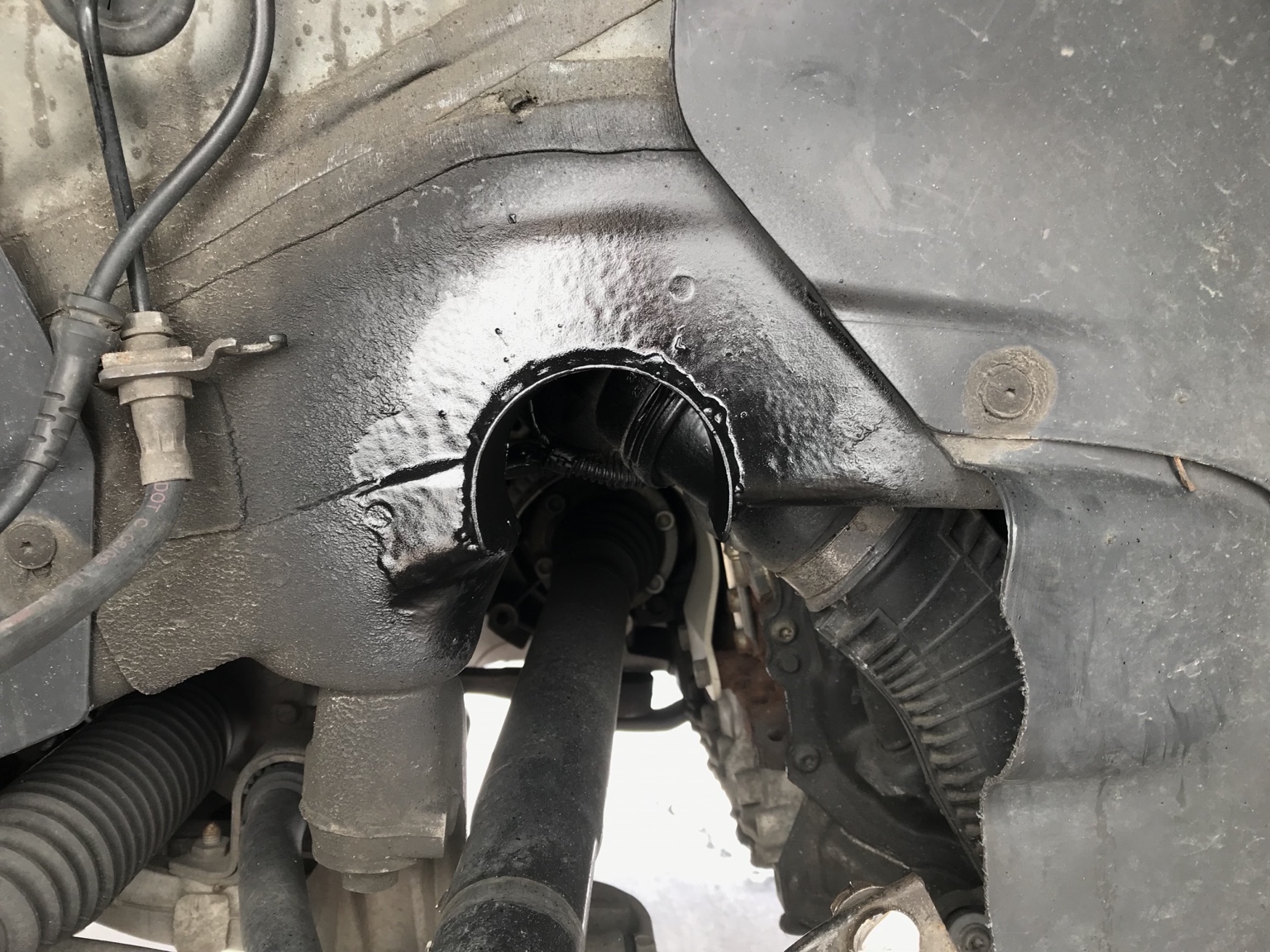 Finished coated frame notch above the axle for additional clearance